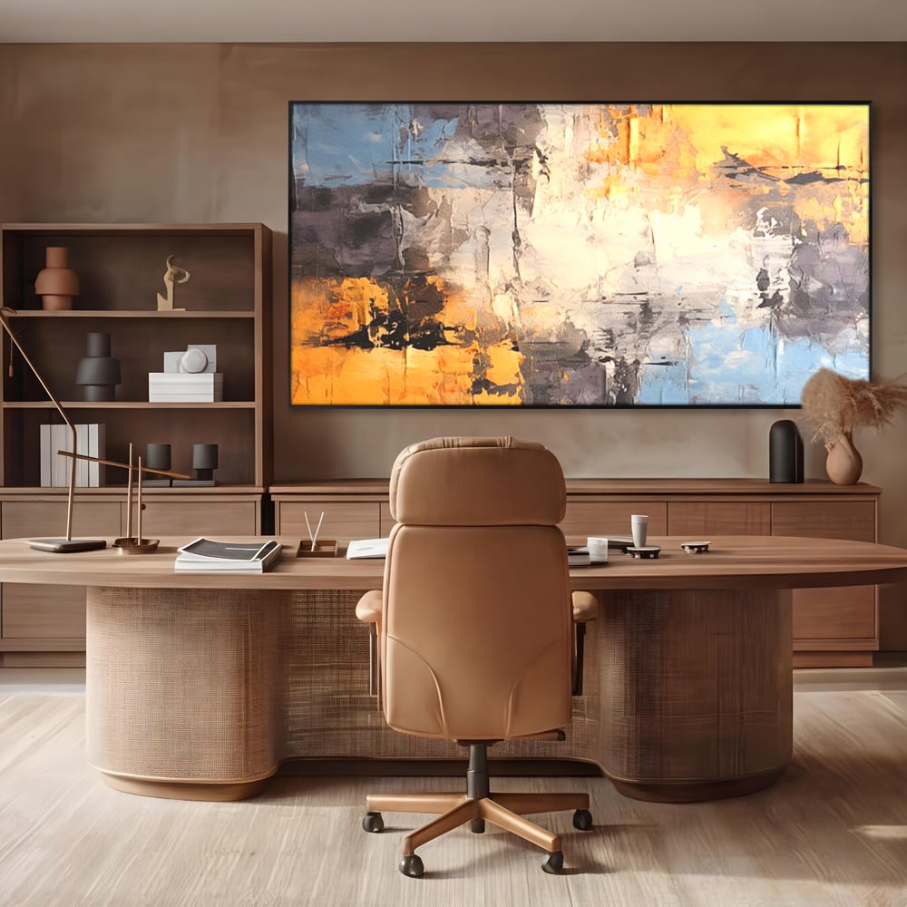 Tablou canvas cu pictura abstracta cu texturi portocalii si gri, in rama de aluminiu negru, pe perete intr-un birou